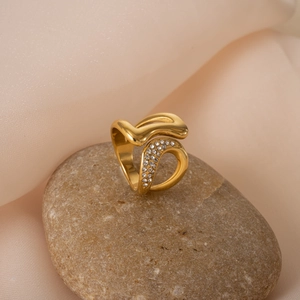 Gold plated 18k titanium ring with irregular wave design and zircon stones on silk