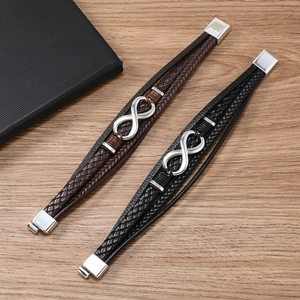 Detail view of woven leather bracelets in black and brown with infinity symbol charms