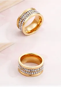Macro shot of gold-plated titanium ring with double rows of sparkling clear zircons