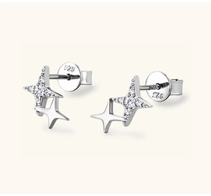 Macro view of S925 sterling silver four-point star earrings with zircon inlay