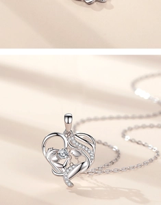 Macro shot of S925 sterling silver heart necklace showing mother and child pendant with stones