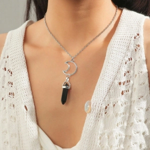 Silver moon and black hexagonal crystal stone pendant necklace worn by a model