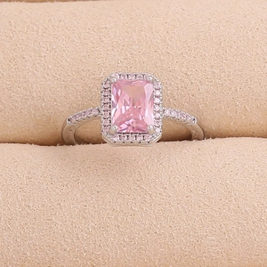 Detailed close-up of a pink rectangle zircon ring with micro-pave setting on silver band