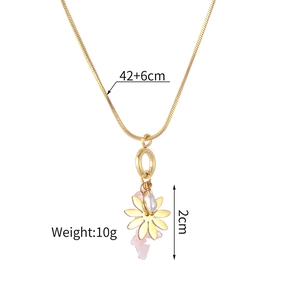 Detail view of gold necklace with pink stone pendant and 42+6cm chain dimension specs