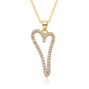 Macro shot of gold-plated elongated heart pendant with sparkling clear cubic zirconia