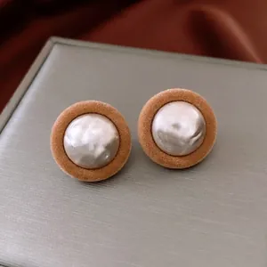 Minimalist round plush earrings with khaki velvet finish and baroque pearl center