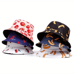 Detailed close-up of fruit pattern bucket hats with strawberry, cherry and banana prints