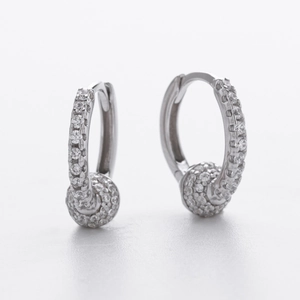 Detail of S925 sterling silver hoop earrings with shimmering pave-set cubic zirconia ball