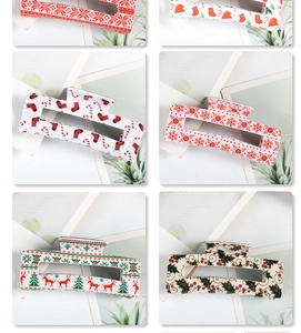 Collection of six Christmas hair clips featuring festive patterns like reindeer and trees
