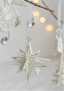 Sparkling silver glitter eight-point star Christmas ornament with white ribbon detail