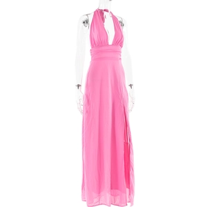 Detail of pink halter neck dress featuring a deep V-neckline and high side leg slit