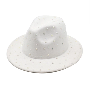 Detailed view of a white fedora hat embellished with colorful iridescent rhinestones