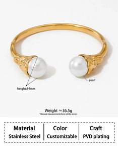 Detail of PVD plated stainless steel bangle with 14mm pearls and textured metal design