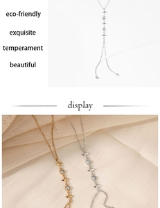 Detailed view of gold and silver Y-shaped necklaces with star pendants and clear zircons