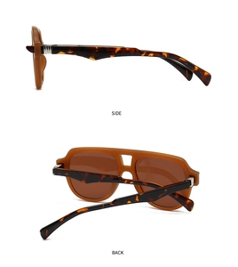 Detail view of vintage amber sunglasses showing side and back tortoise shell frame