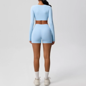 Rear view of light blue yoga set with long sleeve crop top and high waist shorts