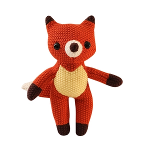 Handmade crochet fox plush toy made of orange and white cotton yarn for children