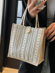Minimalist striped linen tote bag with rope handles and wood button for daily commute