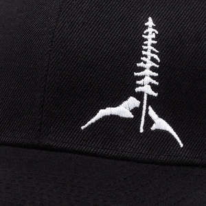 Black mesh baseball cap featuring detailed white pine tree and mountain embroidery