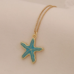 Gold stainless steel necklace featuring a vibrant blue enamel starfish pendant charm