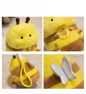 Detail showing plush bee duck charm with gold dollar sign embroidery and yellow lanyard