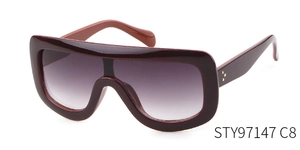 Detail view of burgundy pilot sunglasses featuring gold rivets and purple gradient lenses