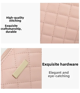 Detailed view of pink quilted leather texture and polished light gold metal hardware logo