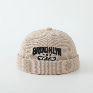 Detail of Brooklyn letter embroidery on khaki corduroy docker cap for kids