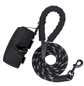 Detail of black reflective rope leash with foam handle and waste bag dispenser
