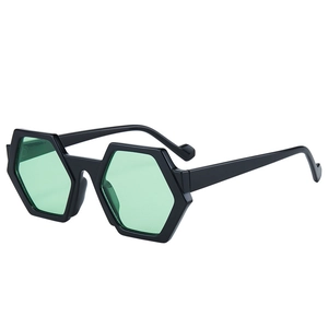 Chic polygonal black frame sunglasses with light green lenses in a 45-degree side view