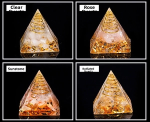 Close-up of Orgone pyramid with natural crystal stones, copper coil and gold foil flakes