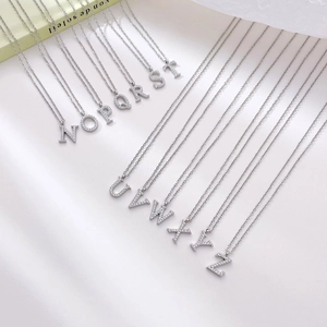 Elegant silver letter pendant necklace with sparkling cubic zirconia on delicate chain