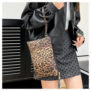 Fashionable leopard print clutch bag with stylish fringe tassel and wrist strap handle