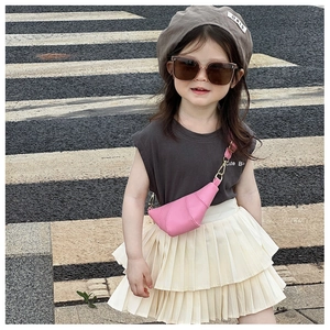 Pink crescent crossbody bag for kids with textured faux leather and gold metal buckle