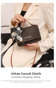 Detail of vintage patterned crossbody bag with silk scarf handle and gold hardware