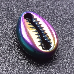Macro detail of iridescent shell pendant with 18k gold plating and rainbow metallic luster