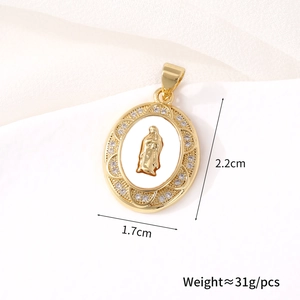 Macro view of oval gold-plated Virgin Mary pendant with mother of pearl and zircon details