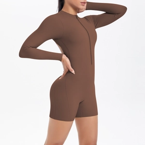 Side view of dark coffee long sleeve yoga romper with front zipper and hollow back