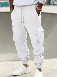 Detail of white cargo sweatpants showing drawstring waist and side flap pockets on model
