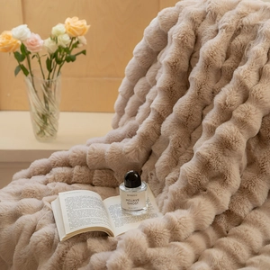 Macro view of plush faux rabbit fur blanket with luxury 3D striped texture and soft pile