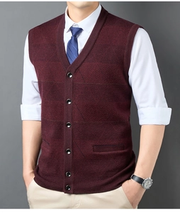 Detail view of burgundy knitted vest with V-neck, buttons, and textured pattern