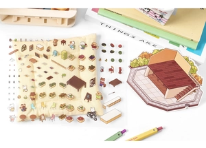 Flat lay of 3D house-themed scrapbooking stickers with cute furniture and animal motifs
