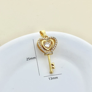 Golden heart-shaped key pendant set with white zircon stones measuring 25mm by 13mm