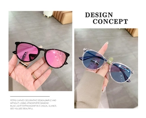Detailed view of oval cat-eye sunglasses with decorative crystals and tinted lenses