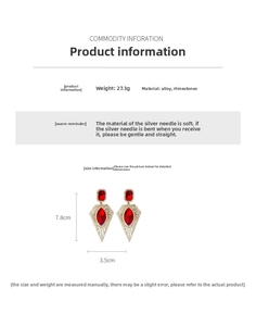 Detail view of vintage gold hollow geometric earrings with red rhodium plating accents