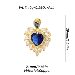 Macro view of heart-shaped copper pendant with blue stone and dimension markings