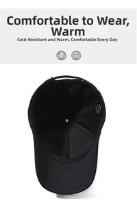 Interior detail of a black baseball cap showing the lining, top button, and care label
