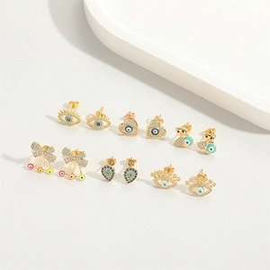 Set of six pairs of gold-plated bow and evil eye stud earrings with colorful zircons