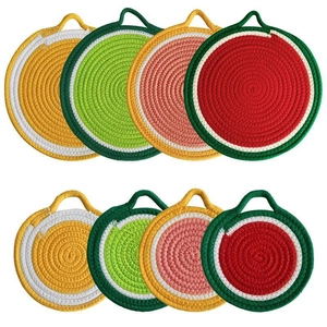 Set of 8 round woven cotton coasters with vibrant fruit designs and hanging loops