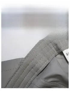 Macro detail of breathable mesh moisture-wicking sweatband inside the grey outdoor cap